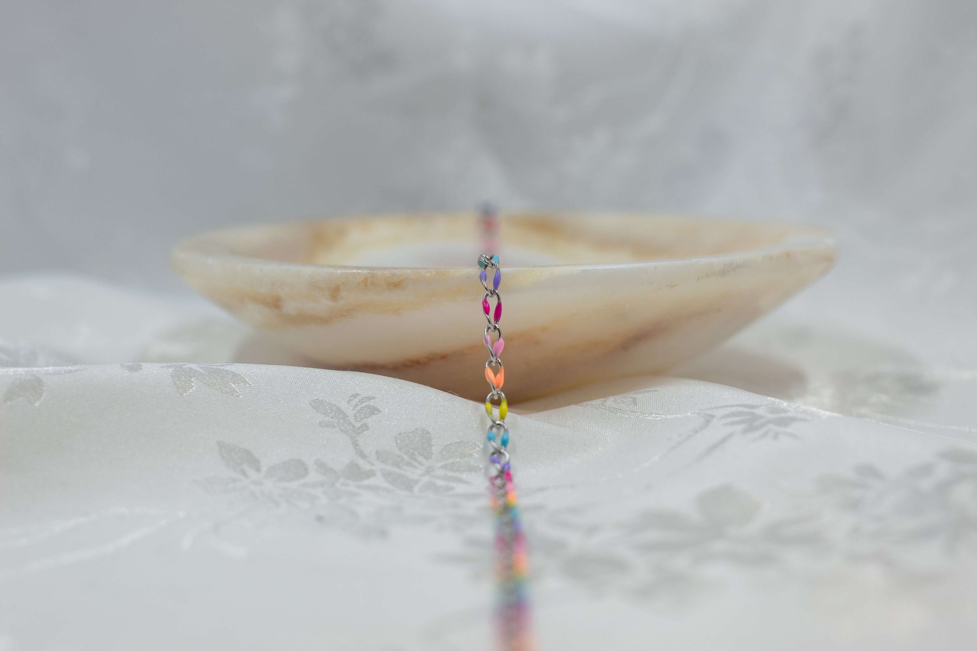 Marissa sterling silver enamel chain with pastel colors on elegant background