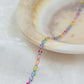 Colorful Marissa sterling silver enamel chain on a decorative plate.